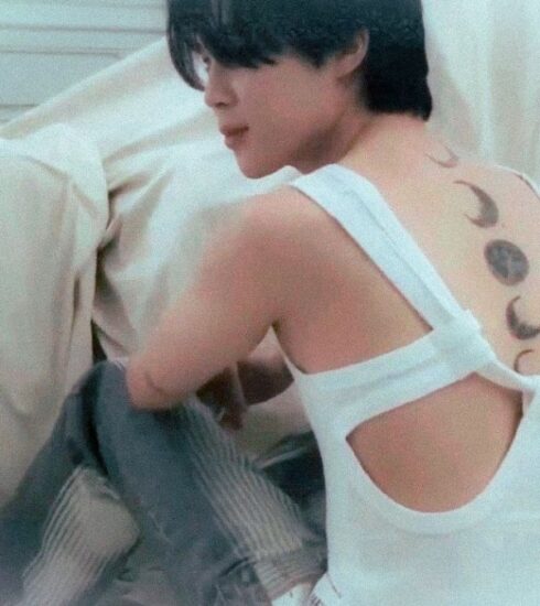 BTS Jimin, the K-pop sensation, has finally revealed his back moon tattoos in a viral video on Instagram, flaunting the new ink to fans worldwide. The fans have been eagerly waiting for Jimin to show the tattoo, and his solo album FACE's success has only added to their anticipation. Jimin has been teasing fans with glimpses of the tattoo, and he finally showed it all in a goofy video. He had originally gotten a moon inked on the back of his neck, but after a fan art by BTS V, he added five more moons in different phases. Read more about the fan meet, Jimin's other tattoos and FACE's success on India TV.