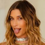 Supermodel Hailey Bieber is all set for summer as she shares captivating pictures of herself basking in the sunlight at the beach. Her stylish ensemble, featuring stringy bikini bottoms and a wet white top, exudes hotness and is perfect for beating the scorching heat. Take a look at her stunning photos and get inspired for the summer season.