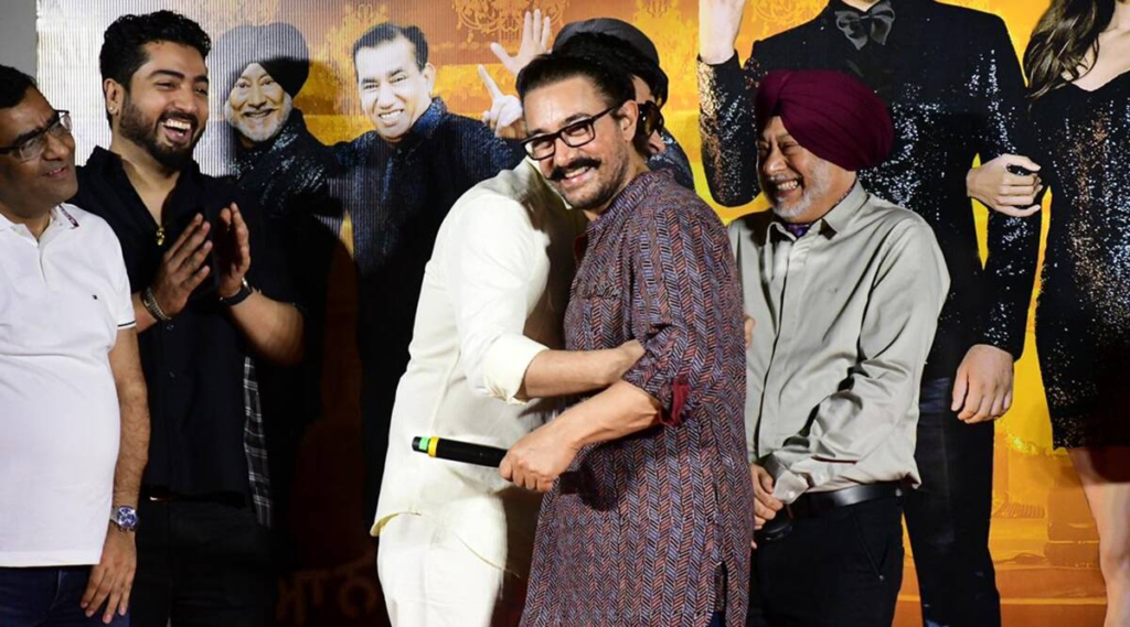 During the trailer launch event of Carry On Jatta 3, Aamir Khan, a self-proclaimed fan of The Kapil Sharma Show, touched Kapil Sharma's feet and revealed his disappointment about not being invited to the show. Read on to know more about the amusing banter between the superstar and the comedian.

