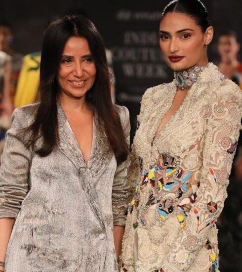 Athiya Shetty dazzled as she walked the ramp for designer Anamika Khanna at India Couture Week. Husband KL Rahul couldn't contain his admiration for his beautiful wife. Learn more about their heartwarming love story and her stunning runway appearance.