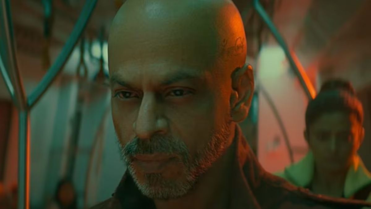 Shah Rukh Khan's bald look in Jawan Prevue has become the talk of the town. Spot the Hindi tattoo on his head and get all the details about his different and never-seen-before looks in the highly anticipated film. Find out why this new look has grabbed everyone's attention.
