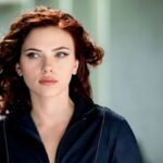 Scarlett Johansson's unique fashion sense and stunning beauty are on full display in a mesmerizing throwback photo. Wearing a bold sheer mesh ensemble, the actress proves she was born to portray Black Widow. Scroll ahead to check out the picture and read about her captivating style statements.