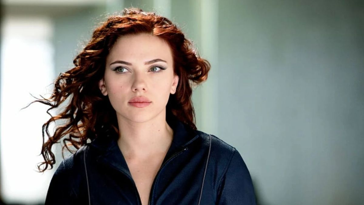Scarlett Johansson's unique fashion sense and stunning beauty are on full display in a mesmerizing throwback photo. Wearing a bold sheer mesh ensemble, the actress proves she was born to portray Black Widow. Scroll ahead to check out the picture and read about her captivating style statements.