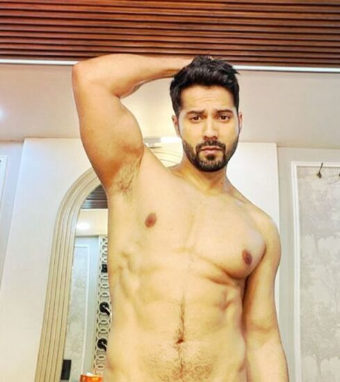 In a recent viral video, Varun Dhawan indirectly tackles the ongoing fake abs controversy, leaving netizens speculating if it's directed towards Salman Khan. Find out more about this humorous exchange and the reactions it sparked.