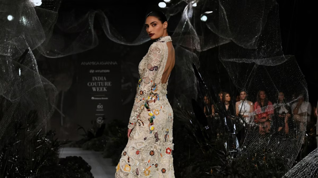 Athiya Shetty dazzled as she walked the ramp for designer Anamika Khanna at India Couture Week. Husband KL Rahul couldn't contain his admiration for his beautiful wife. Learn more about their heartwarming love story and her stunning runway appearance.