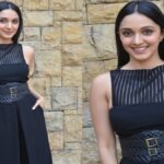 Actress Kiara Advani enchants fans by confidently flaunting her well-toned curves and flawless skin in a striking black dress. Discover her captivating ensemble featuring a s*xy high slit and unique cutouts that leave a lasting impression.