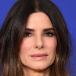 Sandra Bullock puts Hollywood career on hold to care for Bryan Randall as he battles motor neuron disease, showing her commitment and love.