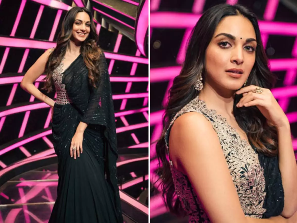  Actress Kiara Advani enchants fans by confidently flaunting her well-toned curves and flawless skin in a striking black dress. Discover her captivating ensemble featuring a s*xy high slit and unique cutouts that leave a lasting impression.