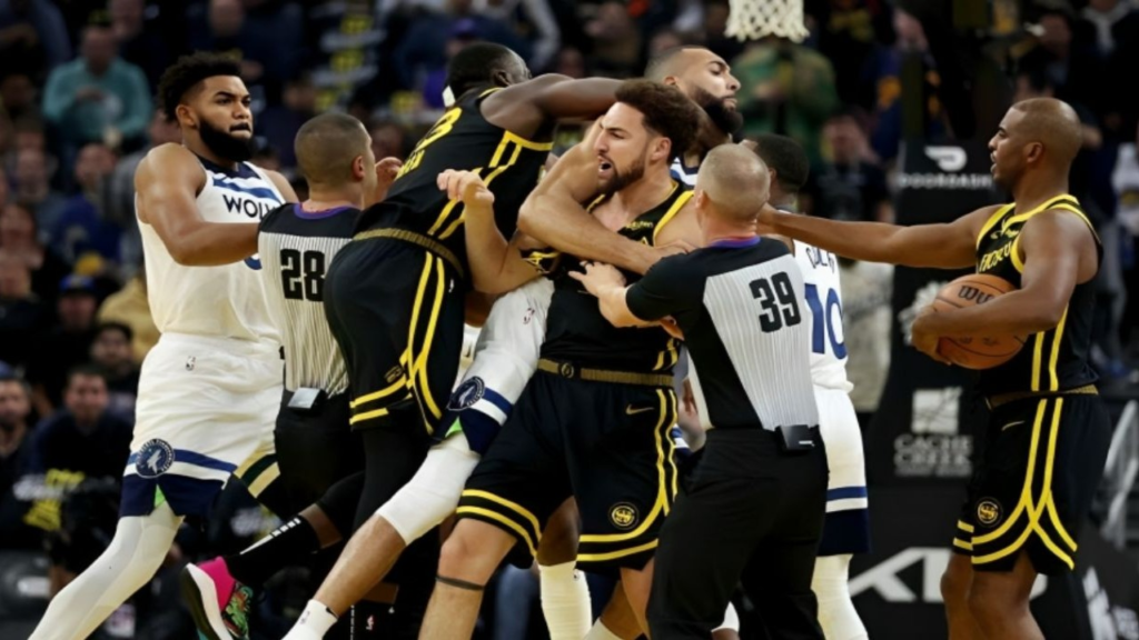 "Fans erupt as Draymond Green, Klay Thompson, and Jaden McDaniels face historic ejections in a wild NBA scuffle. Green's shocking chokehold on Rudy Gobert sparks outrage."
