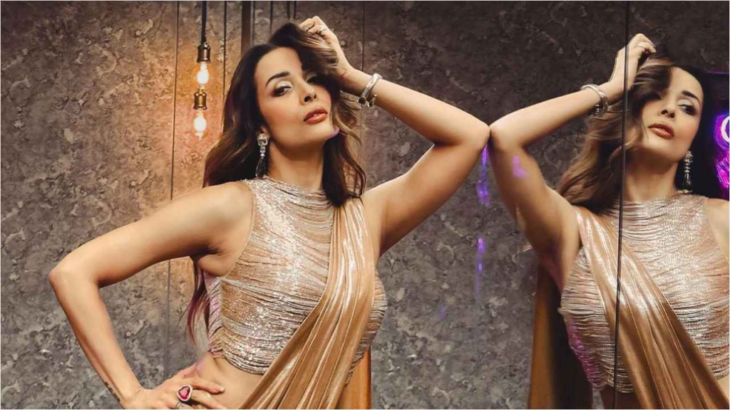 "Dive into the details of Malaika Arora's mesmerizing look in Sonaakshi Raaj's liquid gold saree, a blend of tradition and trend, perfect for festive occasions."
