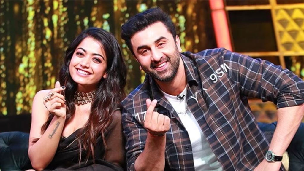  "Catch the sweet moment as Rashmika Mandanna imparts Kannada lessons to Ranbir Kapoor during Animal promotions at Indian Idol. The heartwarming exchange is sure to win hearts."
