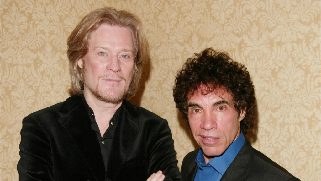 "Delve into the surprising legal feud between Hall & Oates as Daryl Hall obtains a restraining order against John Oates, shaking the foundation of their enduring friendship."
