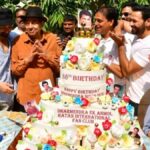 "Veteran actor Dharmendra celebrates his 88th birthday with son Sunny Deol, cutting a massive cake surrounded by fans and paparazzi. Watch the heartwarming moments!"