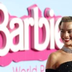 "Discover the intriguing behind-the-scenes drama as Margot Robbie shares details of a call from Oppenheimer producer Charles Roven, leading to a clash in the release dates of 'Barbie' and 'Oppenheimer.' Robbie's refusal to yield resulted in unexpected success, creating the Barbenheimer phenomenon."
