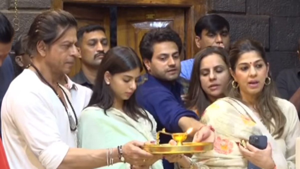 Shah Rukh Khan's protective act at Shirdi Temple for daughter Suhana creates a buzz online. Dive into the heartwarming moment and Dunki release updates.