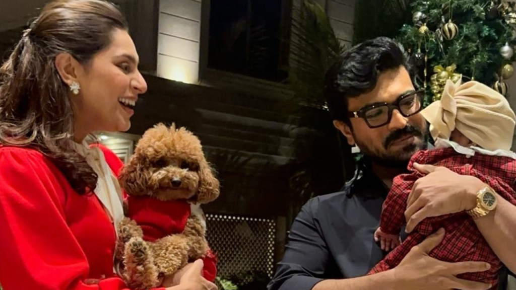 "Ram Charan and Upasana share a touching family photo featuring daughter Klin Kaara and pet dog Rhyme. Upasana praises Ram Charan as the best dad in this heartwarming moment."
