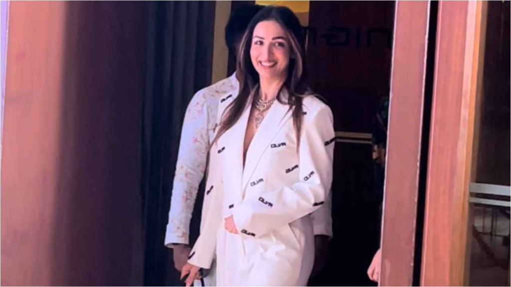 "Malaika Arora steals the spotlight in a classy ivory pantsuit, blending timeless charm with Gen-Z style – a captivating narrative in high-end fashion."