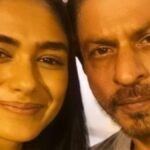 "In an exclusive interview, Mrunal Thakur shares insights on why she associates the 'Queen of Romance' title with Bollywood icon Shah Rukh Khan, adding a unique twist to her cinematic journey."