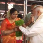 "Prime Minister Narendra Modi graces the joyous occasion of Suresh Gopi's daughter's wedding, adding political charisma to cultural celebrations in Guruvayur."