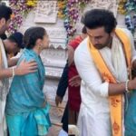 "Experience the charm as Ranbir Kapoor embraces his protective side at the Ram Temple, leaving fans awestruck. Alia Bhatt's luck shines through in these exclusive snapshots capturing the couple's heartwarming moments."