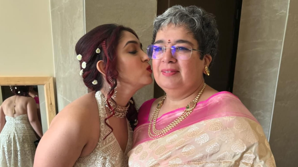  In an intimate capture, Ira Khan shares a kiss with her mother, Reena Dutta, during an unseen mehendi ceremony. Explore the warmth of their bond in this touching moment between mother and daughter. 