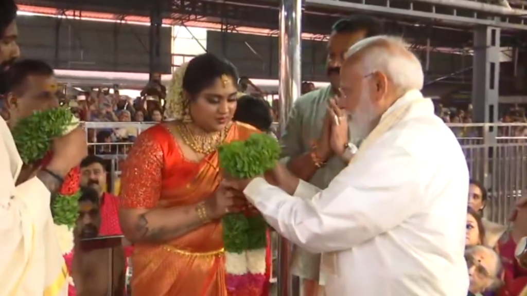 "Prime Minister Narendra Modi graces the joyous occasion of Suresh Gopi's daughter's wedding, adding political charisma to cultural celebrations in Guruvayur."






