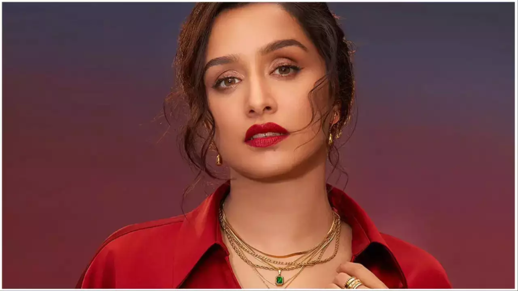 Shraddha Kapoor’s latest social media post showcasing her in a striking red dress led to a humorous fan demand for her Aadhar card photo. Her witty reply adds to the fun!

